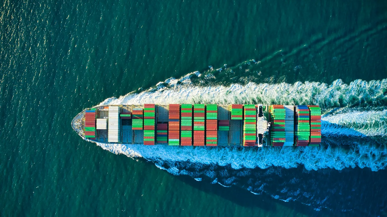 Cargo ship carrying containers on open ocean
